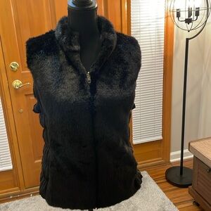 Reversible black faux fur vest.